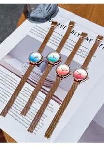 Detail showing gradient colored dials and rose gold mesh straps of Eavanlin watches