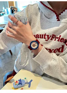 Detail view of GCCLIYO fashion silicone watch with a cartoon burger illustration.