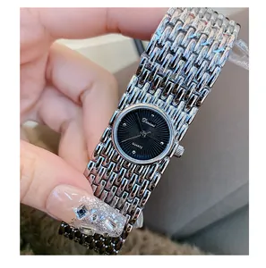 Detailed view of Dinimi silver bracelet watch featuring a sleek minimalist black dial
