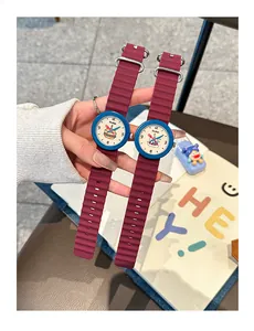 Detail of Gccliyo school-style watches with red silicone straps and cartoon illustrations