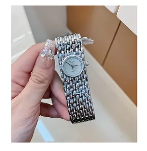 Detailed view of Dinimi vintage silver quartz watch featuring an elegant bracelet style strap