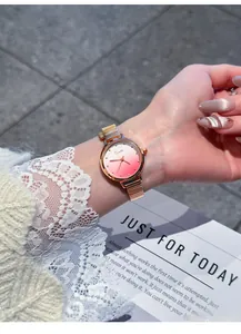 Close-up detail of EAVANLIN women's quartz watch with pink gradient dial and mesh strap