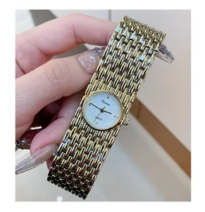Close-up detail of the vintage Dinimi gold bracelet watch for women with quartz movement