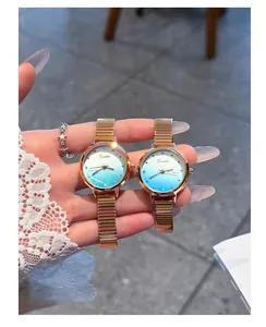 Macro view of Eavanlin luxury gold watches featuring gradient blue glitter dials.