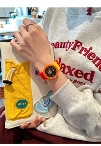 Lifestyle detail of a vibrant silicone watch featuring a cute burger illustration on dial.