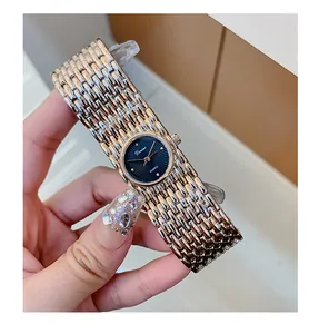 Close-up of a Dinimi lady's quartz watch with an elegant rose gold bracelet band.