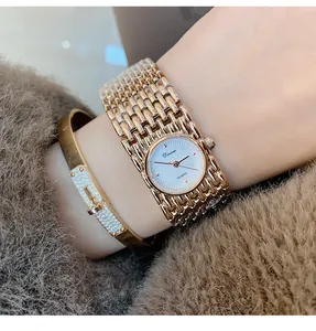 Close-up view of Dinimi vintage rose gold quartz bracelet watch on a woman's wrist