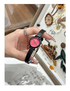 Detailed view of GccIiyo minimalist small round watch with red dial and black leather strap