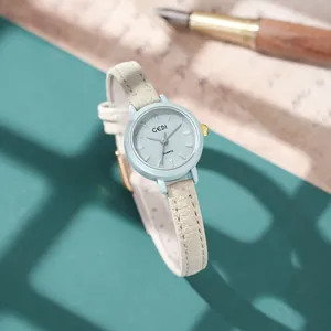 GEDI minimalist women's quartz watch with light blue dial and cream leather strap