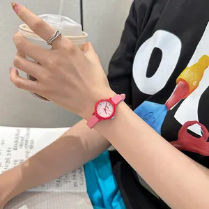Vibrant red round watch with pink leather strap for fashionable students.