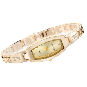 Detailed view of women's gold-tone bracelet watch with elegant rhinestone accents.