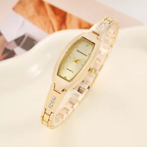 Fashionable gold women's bracelet watch featuring a rectangular dial, shown in detail view