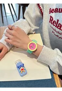 Close-up detail of GCCLIYO color-block silicone watch featuring a cute cartoon illustration dial
