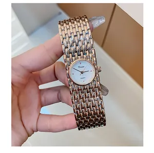 Detailed view of Dinimi vintage rose gold bracelet watch with white dial for women