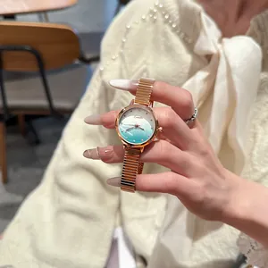 Elegant EAVANLIN women's quartz watch with gradient blue dial and rose gold stretch band