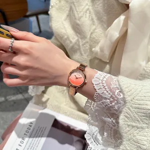 Elegant EAVANLIN rose gold quartz watch for women featuring a stunning pink gradient dial