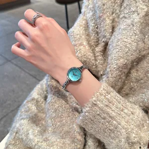 Orologio al quarzo GUOU elegante da donna con quadrante turchese e cinturino argento