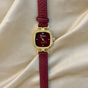 Elegant vintage dark red women's quartz watch with golden case and genuine leather strap