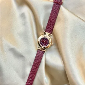 Elegant vintage women's watch with Angola red leather strap and small gold dial