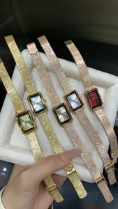 Close-up of GEDI vintage rectangular watches with textured bands in assorted colors