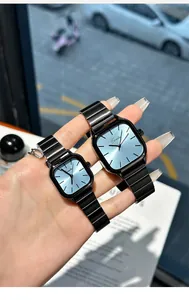 Close-up of Enmulin minimalist couple watches with blue dial and black metal band
