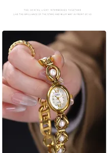 Detailed shot of a GEDI gold-tone bracelet watch featuring elegant pearl links and dial