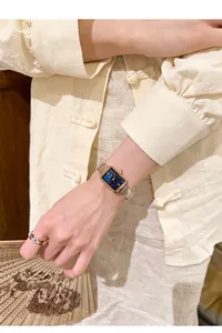 Elegant vintage square quartz watch with blue dial and gold mesh strap detail