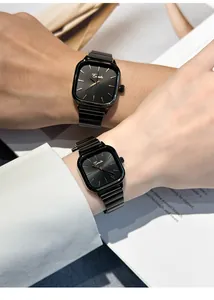 Close-up detail of Evenlin square black couple watches with minimalist dials on wrists