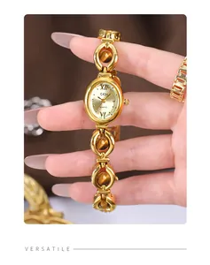 Detailed close-up of GEDI retro gold bracelet watch featuring amber-style gemstone links