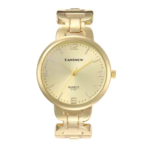 Gedetailleerd overzicht van goudkleurig rond kwartshorloge voor dames met schakelarmband
