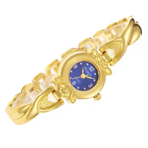Montre à quartz élégante pour femme, ton or, cadran bleu et bracelet entrecroisé.