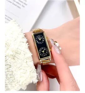 Close-up of Gedi dual time zone rectangular gold watch with black dial and mesh strap.