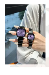 Detail of Eevonlin couple watches featuring purple sunray dials and black metal bands
