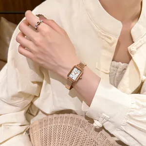 Elegant vintage rectangular rose gold quartz watch with a white marble face dial