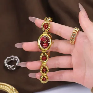 GEDI vintage gold bracelet watch with red dial and stone accents for women