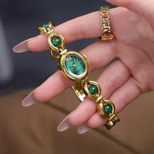 Elegant Gedi gold-toned ladies bracelet watch featuring emerald green dial and bead accents