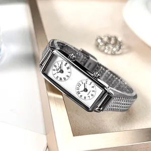 Vintage silver rectangular dual time zone watch with mesh strap and Roman numerals dial
