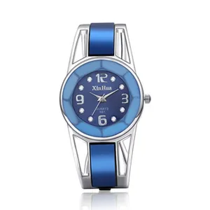 Elegante orologio a bracciale da donna Xinhua con smalto blu e movimento al quarzo cristallo.