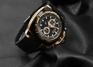 Close-up of luxury V6 men's fashion watch with black silicone strap and gold accents