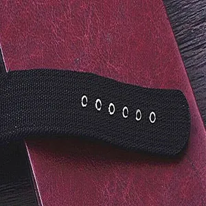 Detailed macro view of durable black canvas sports watch strap with adjustment holes