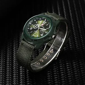 Military style men's sports watch with a green canvas strap and tactical analog dial