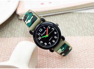 Detailed close-up view of children's camouflage silicone watch with black quartz dial