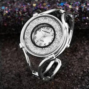 Detailed close-up of a silver ladies' bracelet watch decorated with sparkling crystals