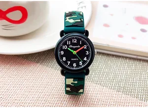 Close-up of children's camouflage watch with silicone strap on a lifestyle desk setting