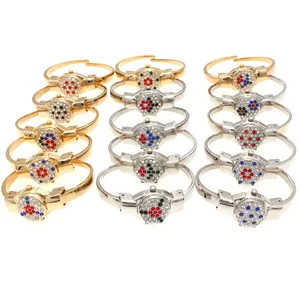 Selection of elegant rhinestone-studded women's bangle watches in gold and silver