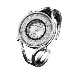 Elegant women's silver quartz bangle watch with sparkly rhinestone dial