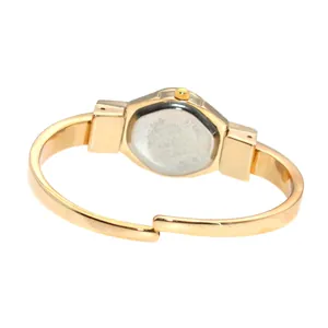 Detailed back view of an elegant minimalist golden fashion women's cuff bracelet watch