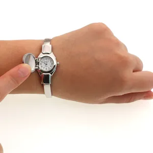 Detail of Changyada women's bangle watch showing the unique flip cover mechanism