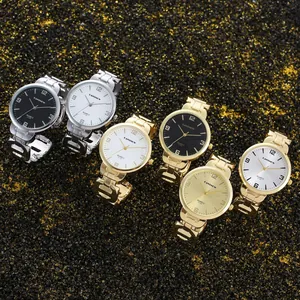 Detailweergave van CANSNOW dameshorloges in goud en zilver op glitter achtergrond
