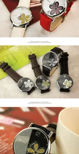 Primo piano di eleganti orologi al quarzo da donna con quadrante a quadrifoglio